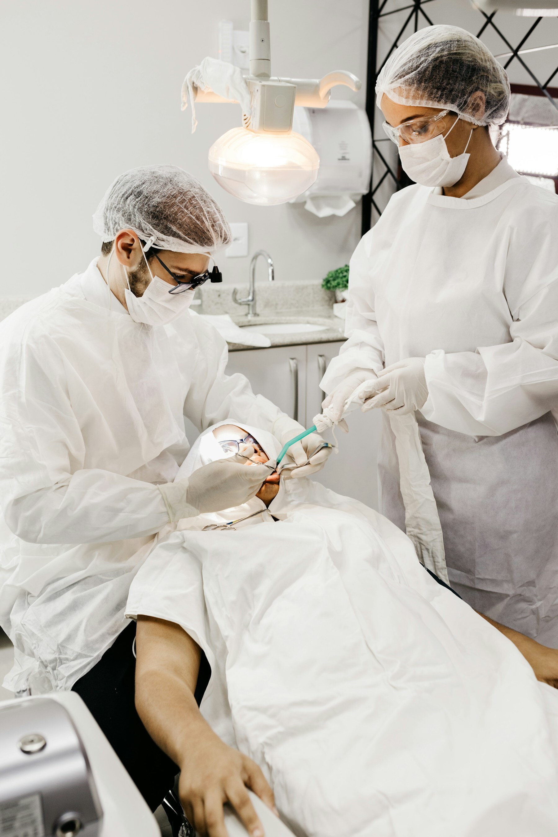 A dental care team treating a patient in a modern clinic