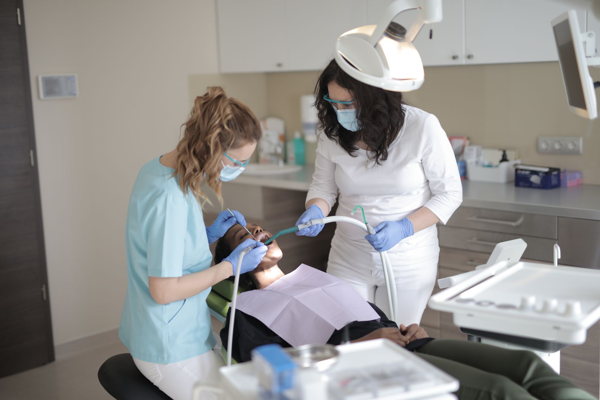 A dental team caring for a patient